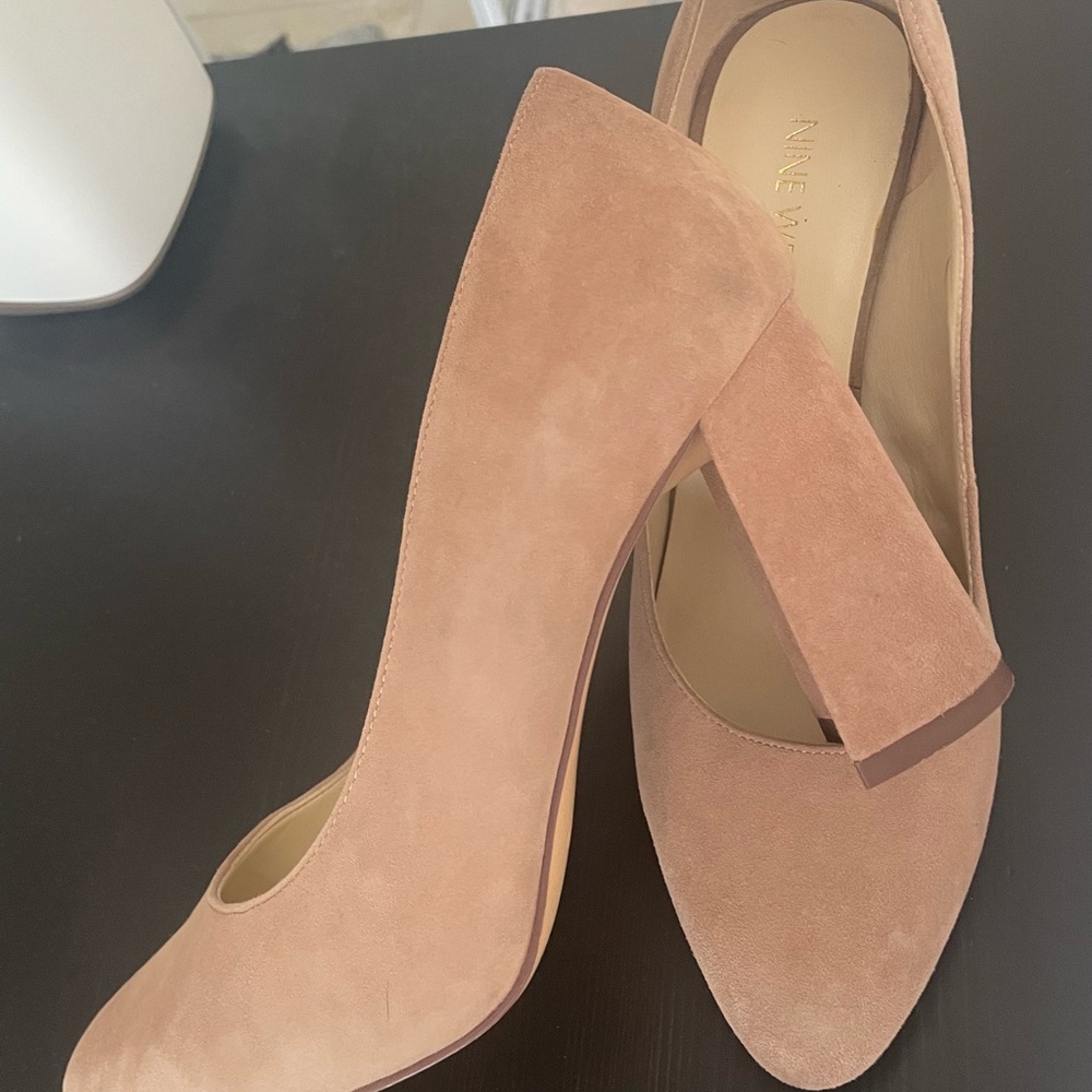 Thick cream-colored heels.